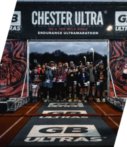 GB Ultras Chester 100 2026 start line showing a group of ultra runners waiting under a race banner for the start gun to go off.