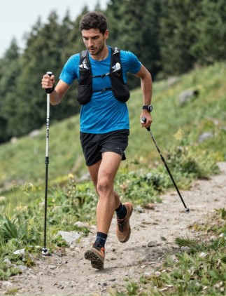walking poles man1 A man with running poles along a trail